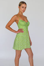 This is an image of Juniper Mini in Kiwi - RESA featuring a model wearing the dress