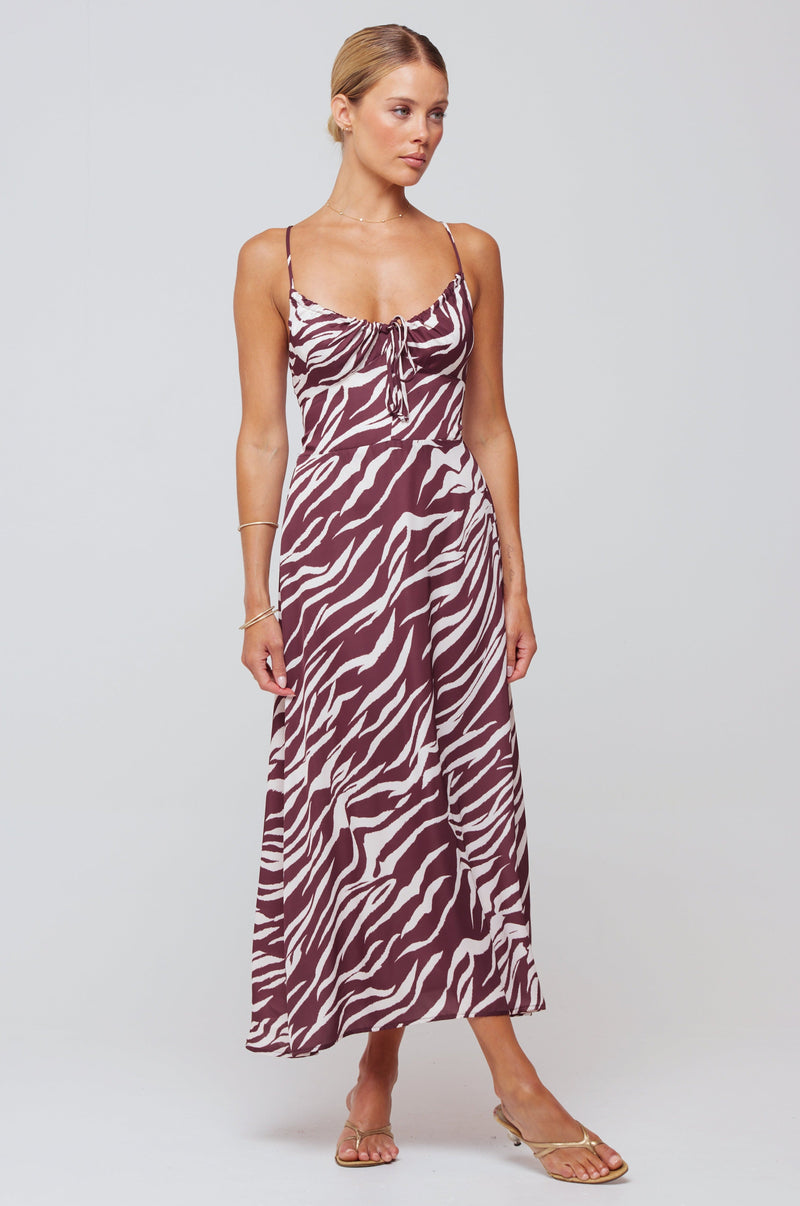 This is an image of Kaitlyn Midi in Kona Chocolate Brown - RESA featuring a model wearing the dress