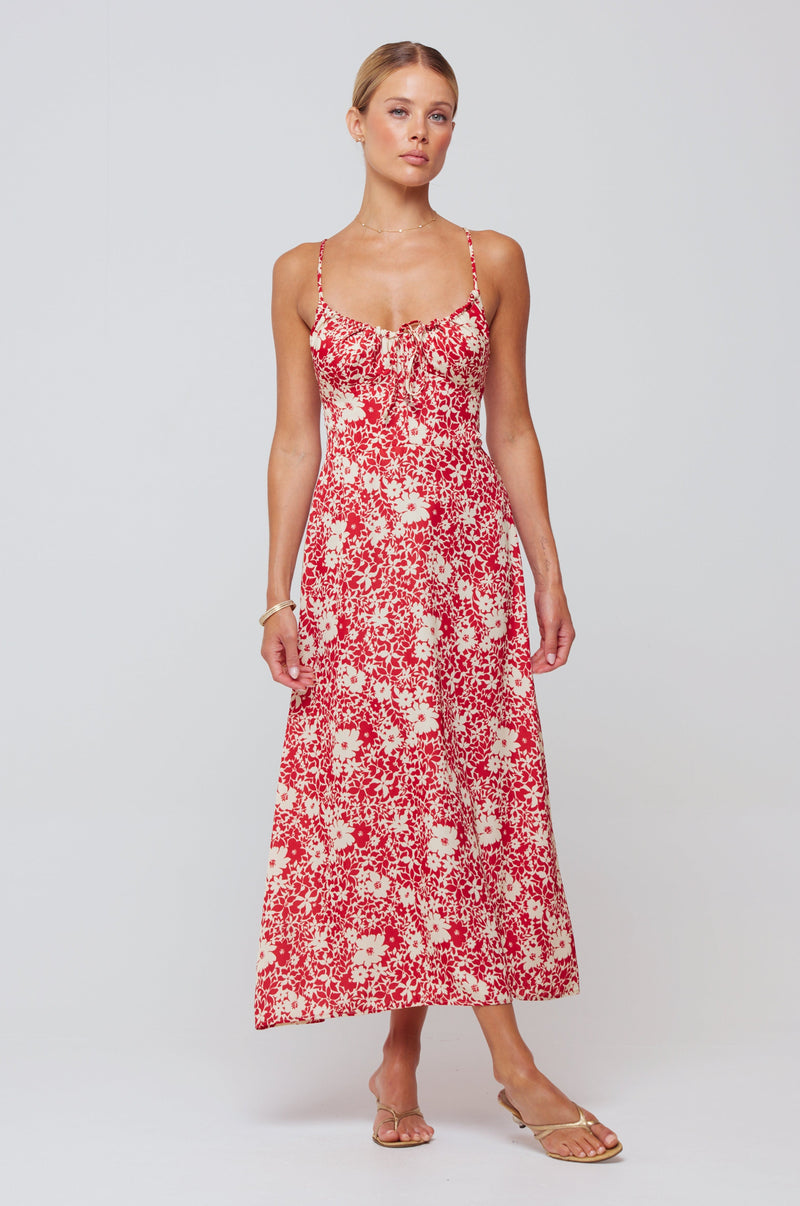 This is an image of Kaitlyn Midi in Magnolia - RESA featuring a model wearing the dress