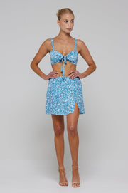 This is an image of Kenzie Skirt in Iris - RESA featuring a model wearing the dress