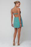 This is an image of Kenzie Skirt in Oasis - RESA featuring a model wearing the dress