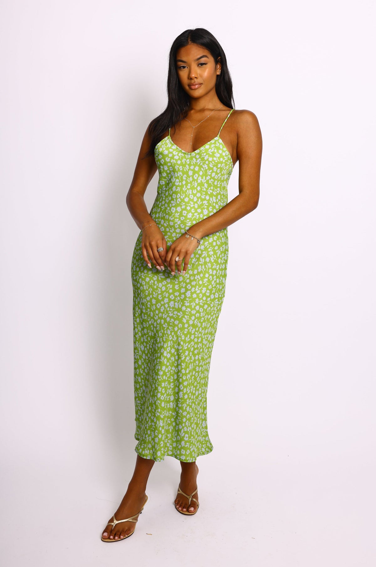 This is an image of Lily Slip in Kiwi - RESA featuring a model wearing the dress