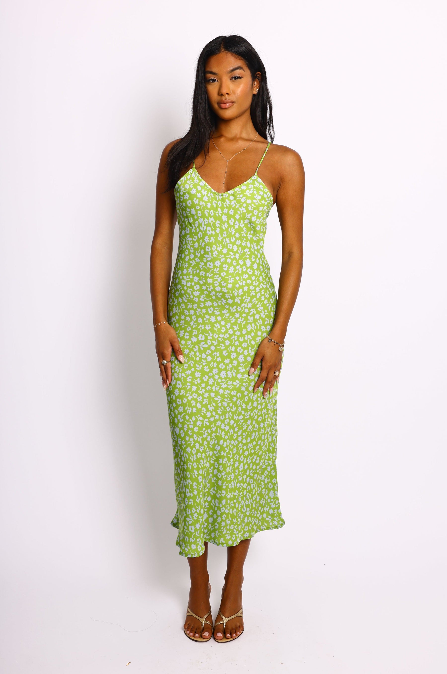 This is an image of Lily Slip in Kiwi - RESA featuring a model wearing the dress