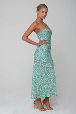 This is an image of Lily Slip in Maldives - RESA featuring a model wearing the dress