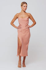 This is an image of Madison Slip in Blush - RESA featuring a model wearing the dress