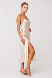 This is an image of Madison Slip in Champagne - RESA featuring a model wearing the dress