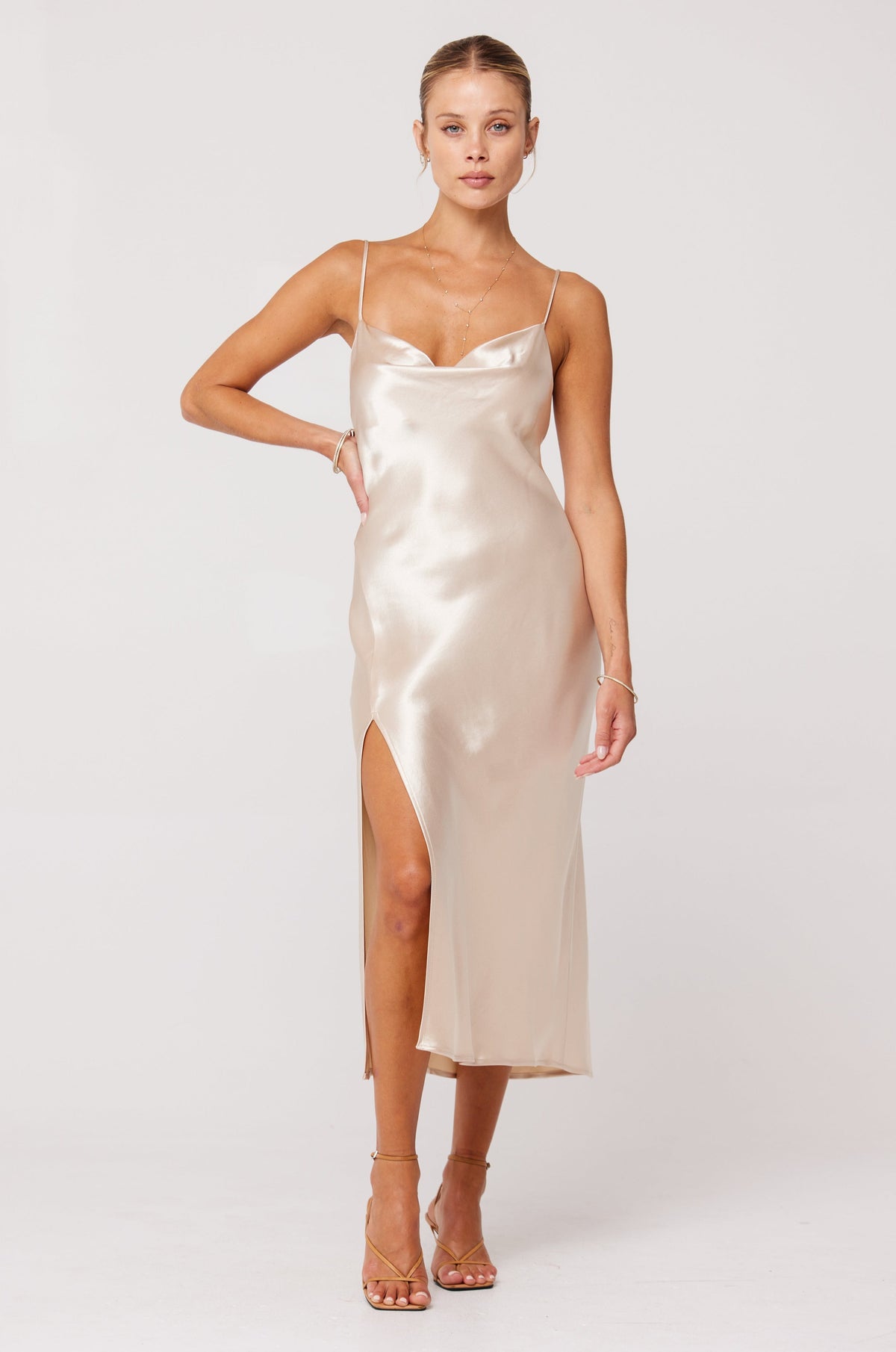 This is an image of Madison Slip in Champagne - RESA featuring a model wearing the dress