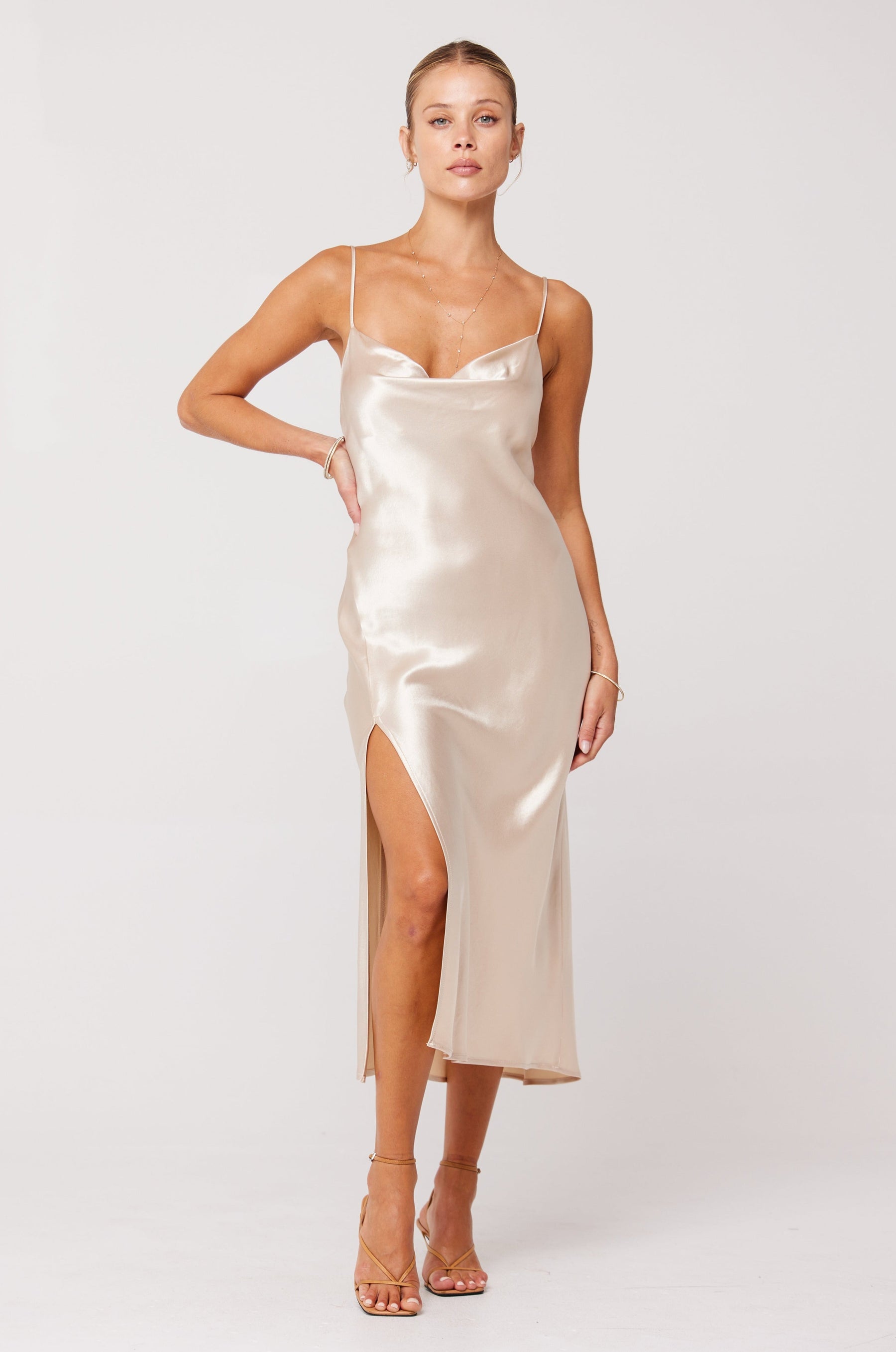 This is an image of Madison Slip in Champagne - RESA featuring a model wearing the dress