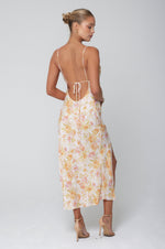 This is an image of Madison Slip in Gardenia - RESA featuring a model wearing the dress
