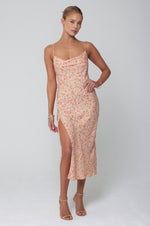 This is an image of Madison Slip in Sunstone - RESA featuring a model wearing the dress