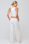 This is an image of Malcolm Trousers in Cream - RESA featuring a model wearing the dress