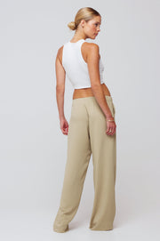 This is an image of Malcolm Trousers in Pistachio - RESA featuring a model wearing the dress