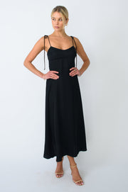 This is an image of Mandi Dress in Black - RESA featuring a model wearing the dress