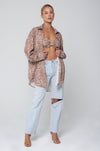 This is an image of Monica Blouse in Dallas - RESA featuring a model wearing the dress