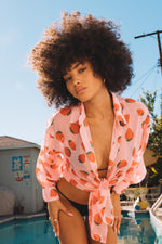 This is an image of Monica Blouse in Montecito - RESA featuring a model wearing the dress
