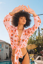 This is an image of Monica Blouse in Montecito - RESA featuring a model wearing the dress