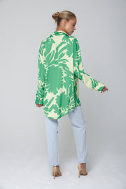 This is an image of Monica Blouse in Rico - RESA featuring a model wearing the dress