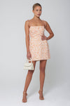 This is an image of Odi Mini in Sunstone - RESA featuring a model wearing the dress