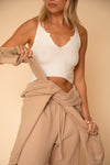 This is an image of Ozzy Tank in Ivory - RESA featuring a model wearing the dress