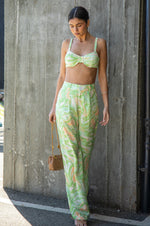 This is an image of Pepper Bra in Limestone - RESA featuring a model wearing the dress