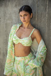 This is an image of Pepper Bra in Limestone - RESA featuring a model wearing the dress