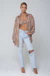 This is an image of Pepper Bra Top in Dallas - RESA featuring a model wearing the dress