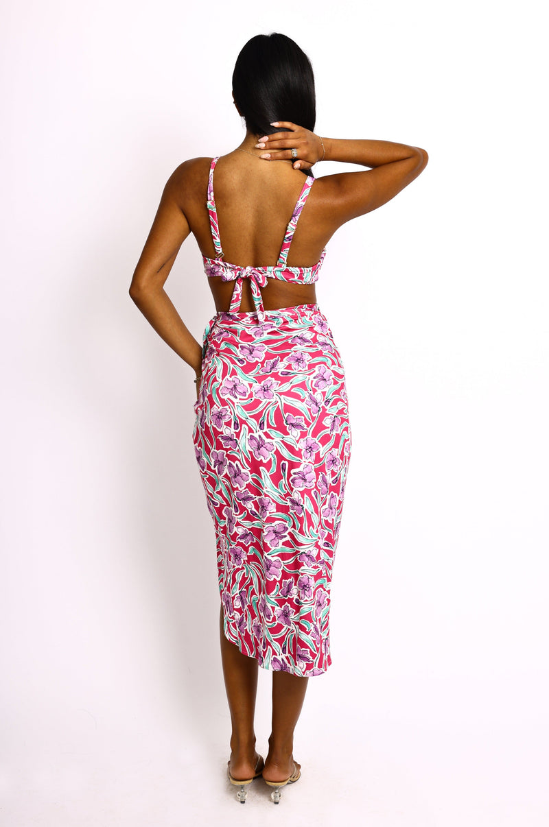 This is an image of Pepper Bra Top in Hibiscus - RESA featuring a model wearing the dress