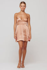 This is an image of Peyton Mini in Copper - RESA featuring a model wearing the dress