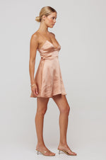 This is an image of Peyton Mini in Copper - RESA featuring a model wearing the dress