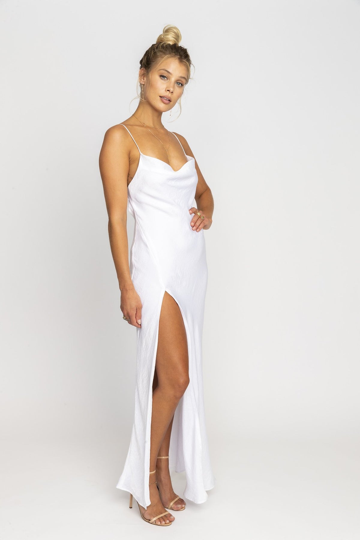 This is an image of River Slip - RESA featuring a model wearing the dress