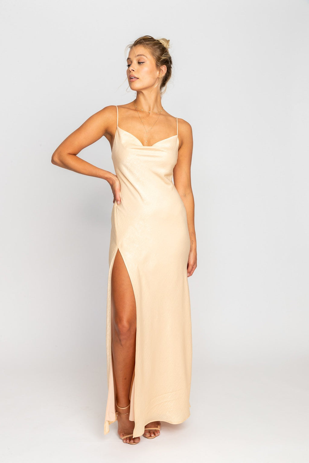 This is an image of River Slip - RESA featuring a model wearing the dress