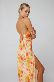 This is an image of River Slip in Ginger - RESA featuring a model wearing the dress