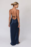 This is an image of River Slip in Navy - RESA featuring a model wearing the dress
