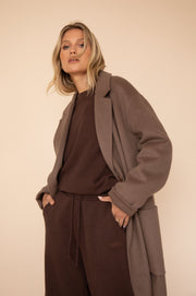 This is an image of Ryder Coat in Taupe - RESA featuring a model wearing the dress