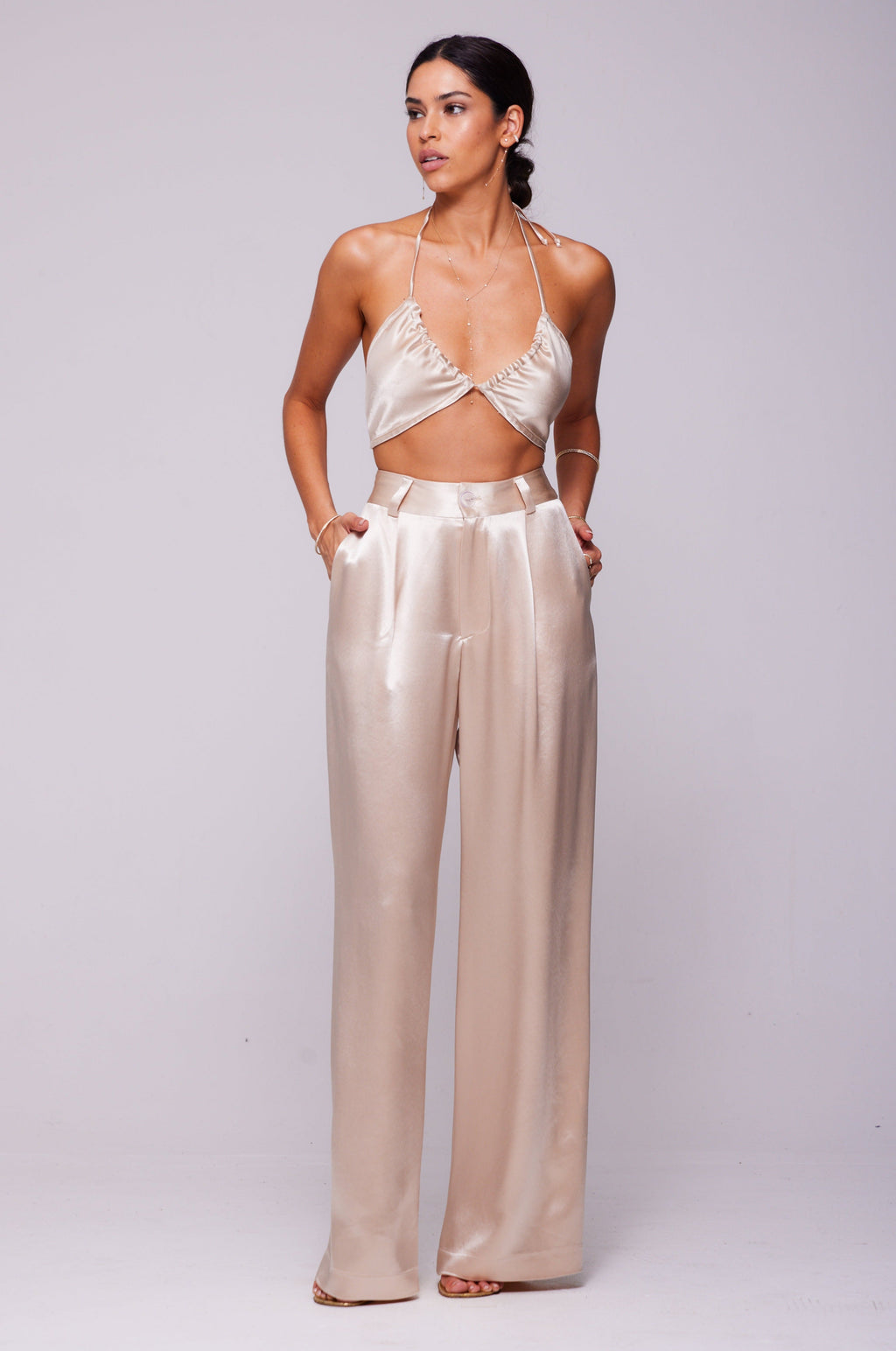 This is an image of Sasha Trouser in Champagne - RESA featuring a model wearing the dress