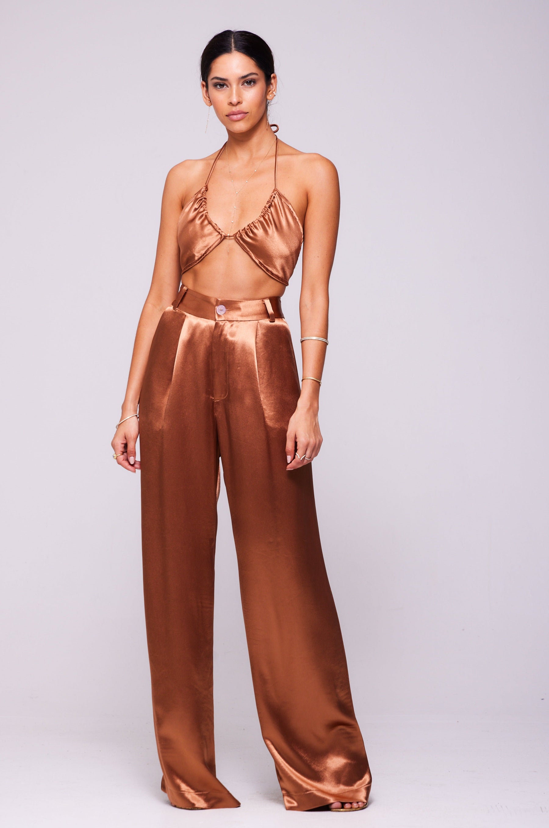 This is an image of Sasha Trouser in Copper - RESA featuring a model wearing the dress