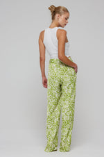 This is an image of Sasha Trouser in Lotus - RESA featuring a model wearing the dress