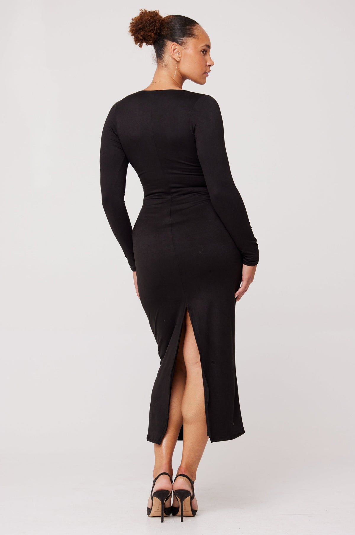 This is an image of Simone Dress in Black - RESA featuring a model wearing the dress