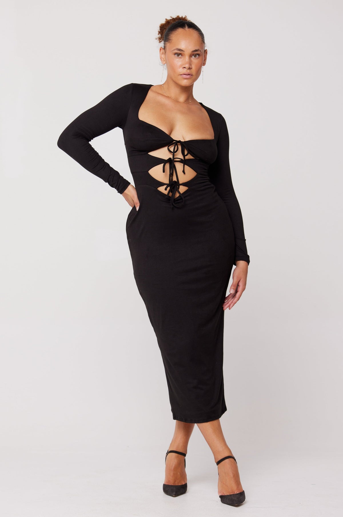 This is an image of Simone Dress in Black - RESA featuring a model wearing the dress