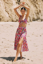 This is an image of Skatie Skirt in Dahlia - RESA featuring a model wearing the dress