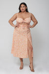 This is an image of Skatie Skirt in Sunstone - RESA featuring a model wearing the dress
