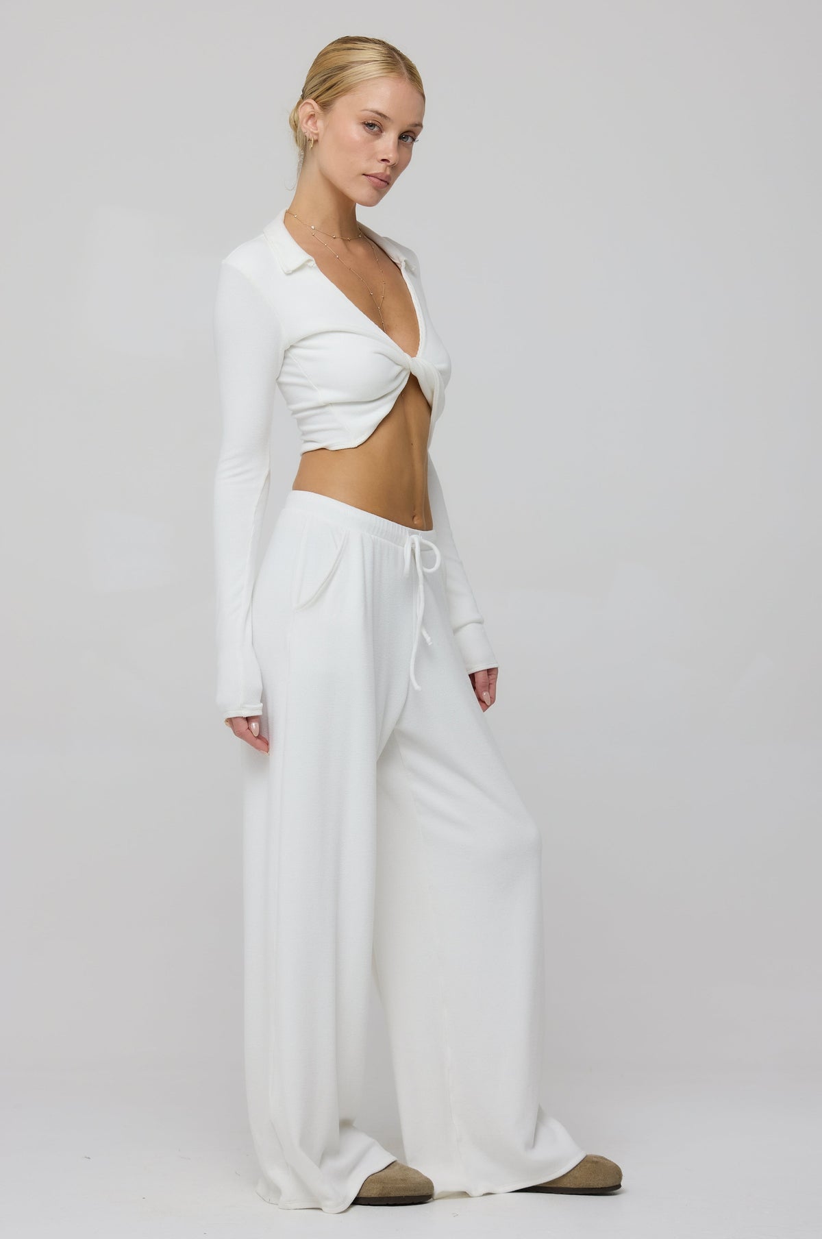 This is an image of Skylar Rib in White - RESA featuring a model wearing the dress