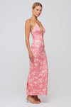 This is an image of Sophia Midi in Guava - RESA featuring a model wearing the dress