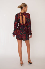 This is an image of Stevie Romper in Monarch - RESA featuring a model wearing the dress