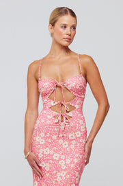 This is an image of Summer Midi in Guava - RESA featuring a model wearing the dress