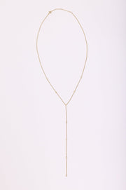 This is an image of Suzanne's Lariat - RESA featuring a model wearing the dress