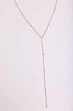 This is an image of Suzanne's Lariat - RESA featuring a model wearing the dress