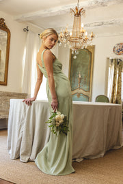 This is an image of Violet Maxi in Sage - RESA featuring a model wearing the dress