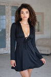This is an image of Willa Mini in Black - RESA featuring a model wearing the dress