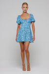 This is an image of Winnie Mini in Iris - RESA featuring a model wearing the dress